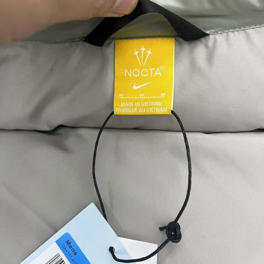 Chaqueta Puffer Nike NOCTA Gris